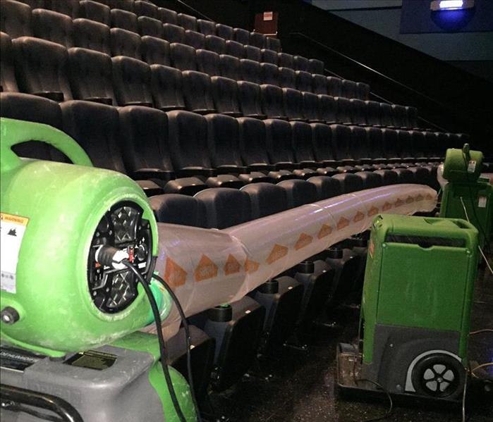 Row of chairs with SERVPRO drying equipment