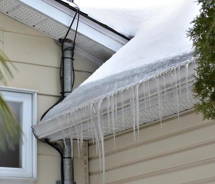 Ice and snow on the roof of a home