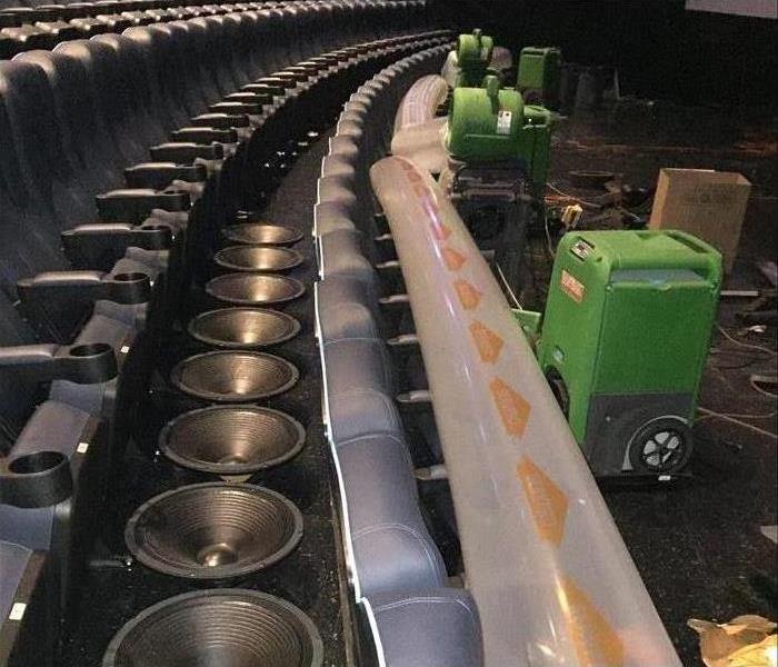 Restoration machines are cleaning a business