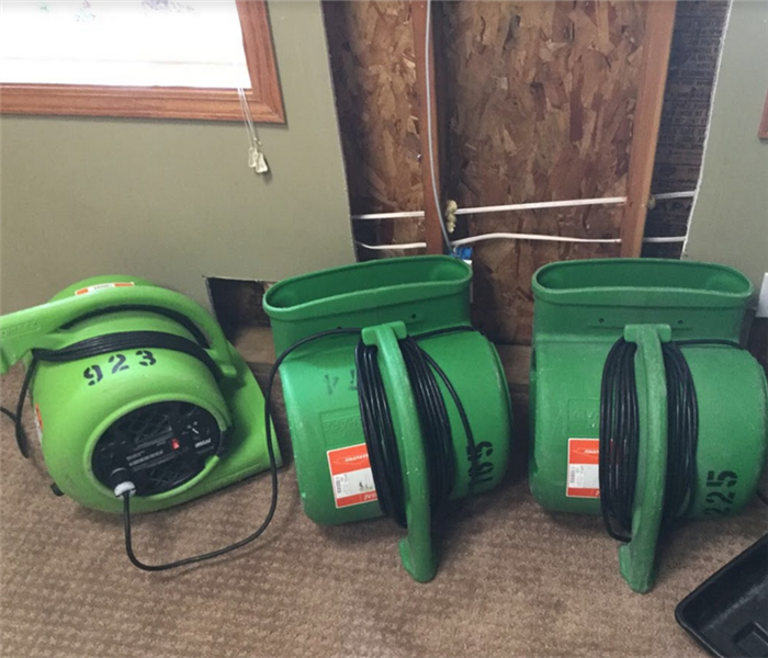 SERVPRO appliances working to repair a room from flood damage